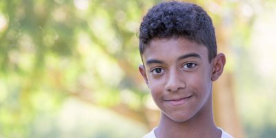 Smiling Teenage Mixed Race Boy